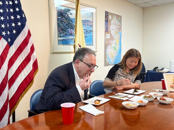 Photo: Assemblywoman Ellen Park and Chairman Roy Freiman of the NJ Assembly Committee on Agriculture and Food Security hosting a kimchi tasting event in the Senate Chamber