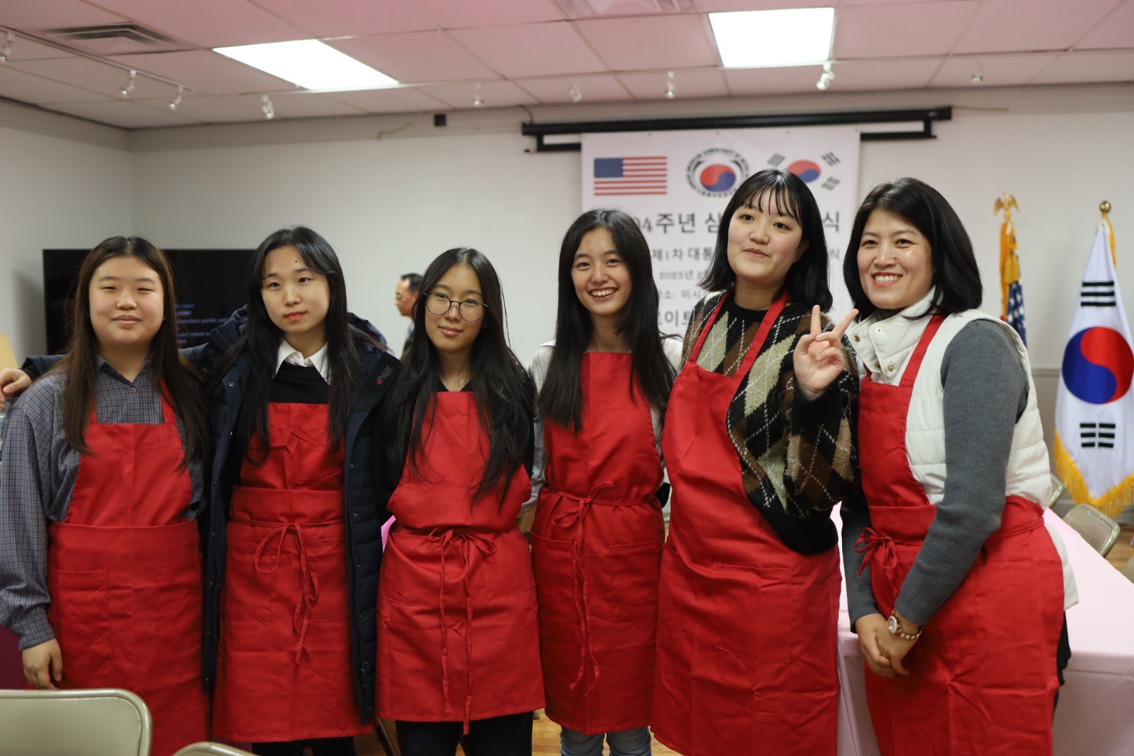 Student volunteers, who helped serve dinner, pose for a group photo
