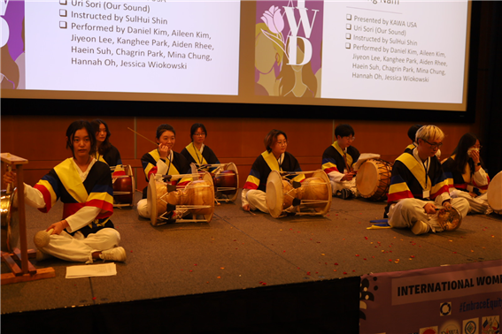 Teen members of Woori Sori putting on a finale for the music and dance performances of the IWD celebration event